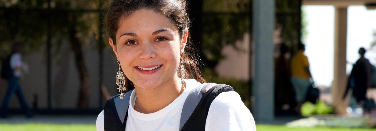 Smiling female student in an outdoor setting